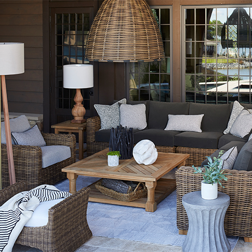 outdoor living room with coffee table and chandelier